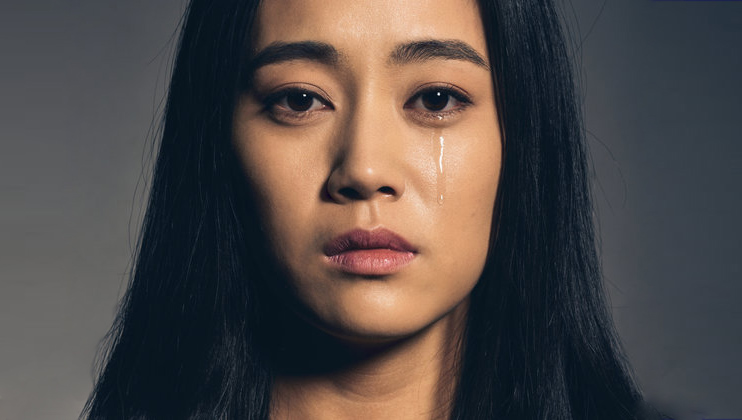Portrait of Chinese young woman crying.